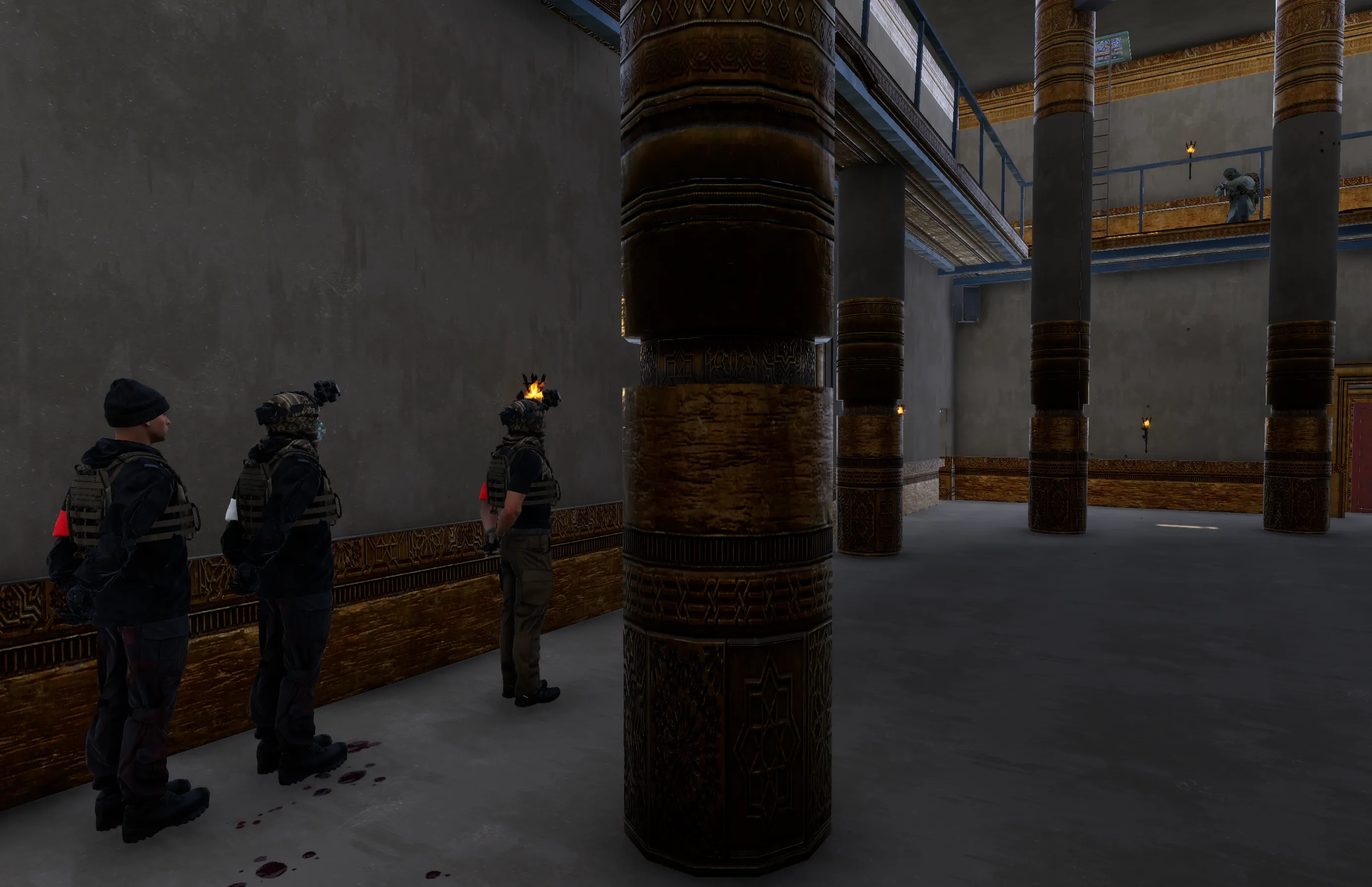 3 PMC's standing with arms on their backs in a row.