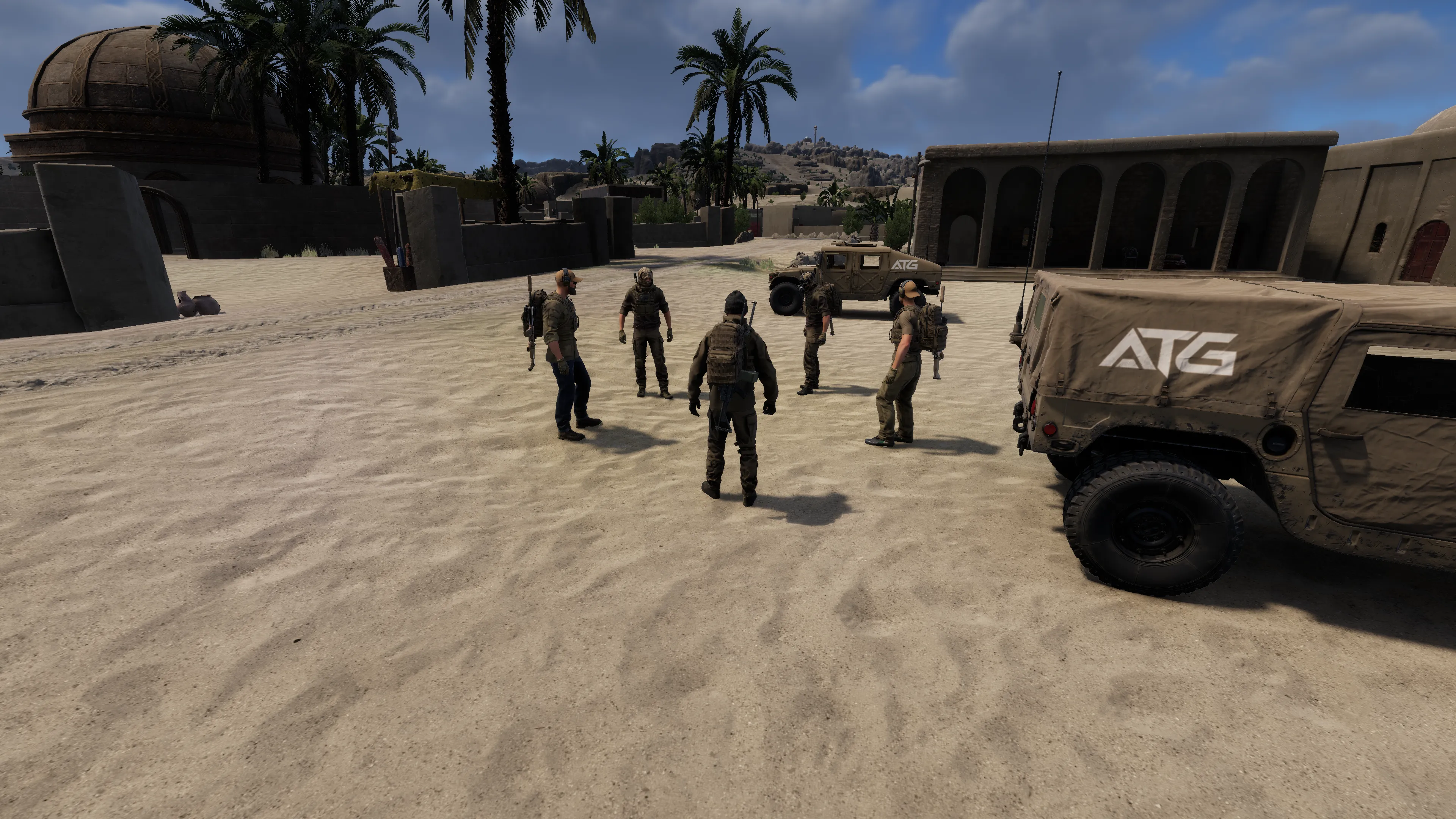 5 pmc operators standing in a circle near ATG humvees
