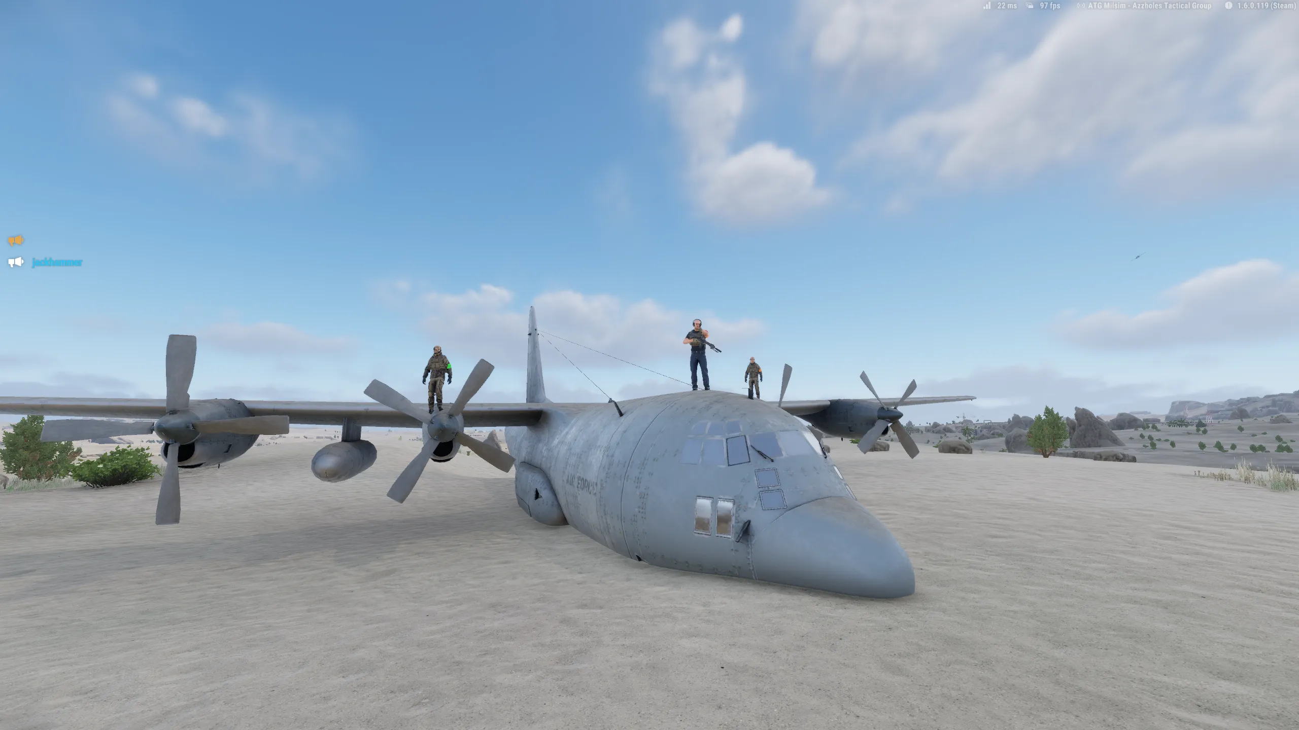 3 people standing on a big cargo plane